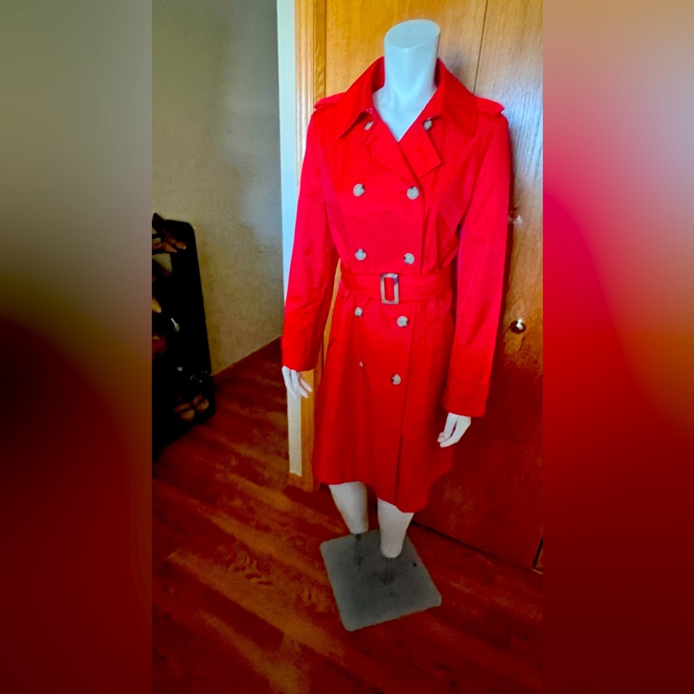 Not worn , red solid mid trench coat with button closure and adjustable belt!